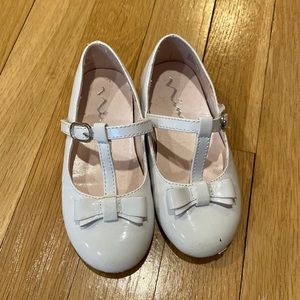 GUC Nina white patent leather bow flat.